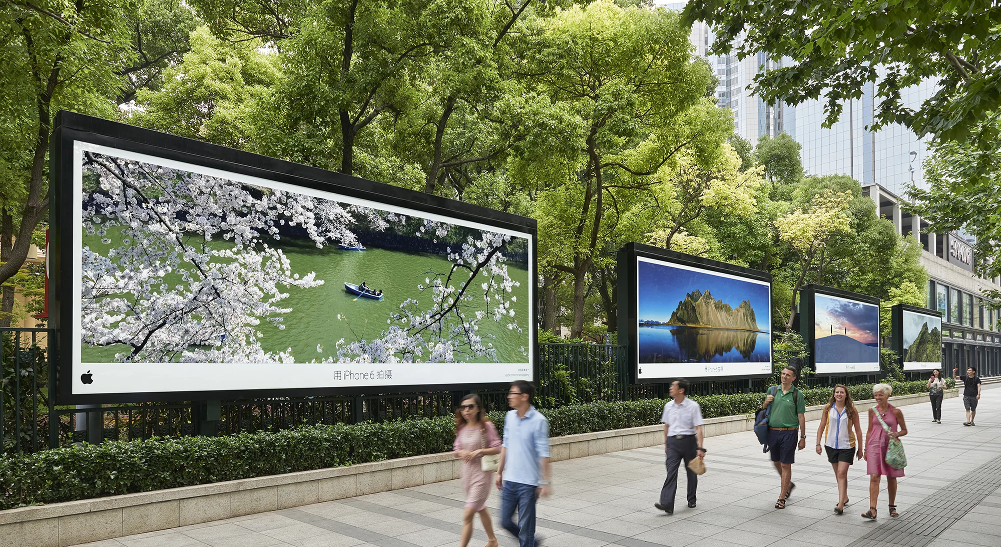 Four large Shot on iPhone photographs installed beside the Shanghai Exhibition Centre