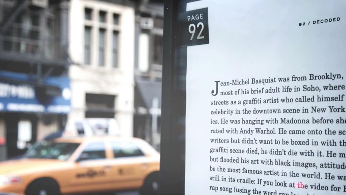 Page 92 of Decoded enlarged in a New York street placement beside a passing taxi