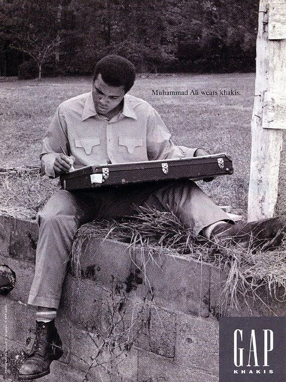 Gap Khakis advertisement with Muhammad Ali seated outdoors looking through a record case.