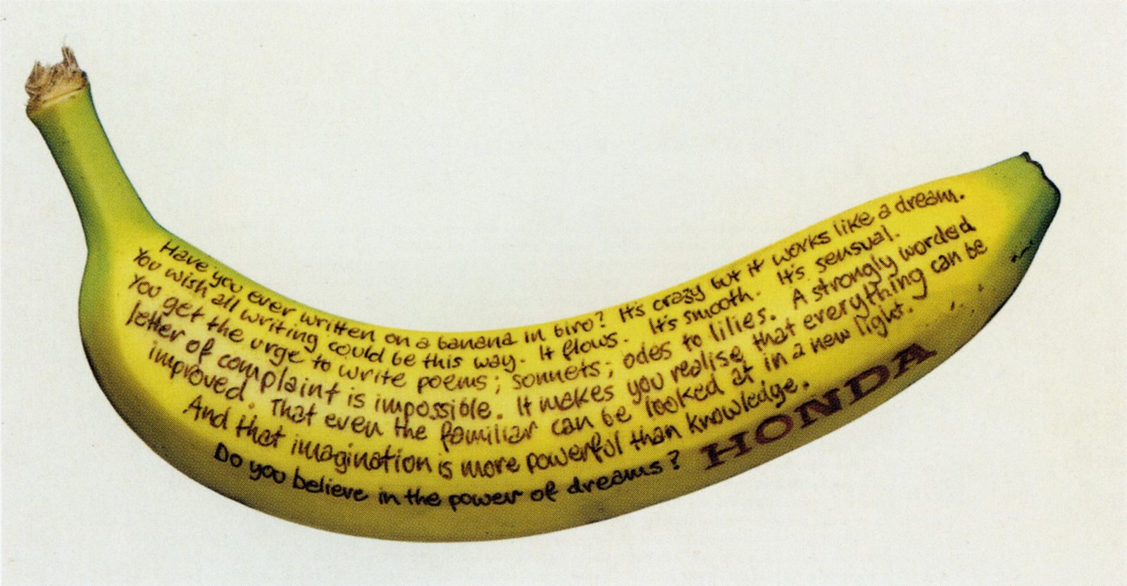 Honda Banana advertisement with the entire handwritten message following the curve of a yellow banana.