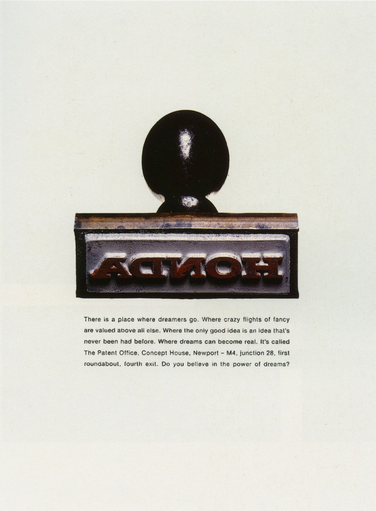 Honda Stamp print advertisement showing the reversed Honda name on a rubber stamp, above copy about the patent office.
