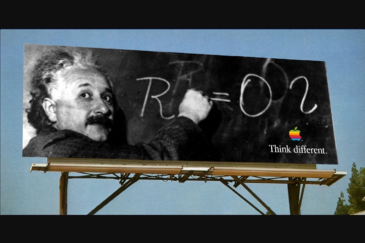 Albert Einstein writes E equals MC squared on an Apple Think Different billboard.