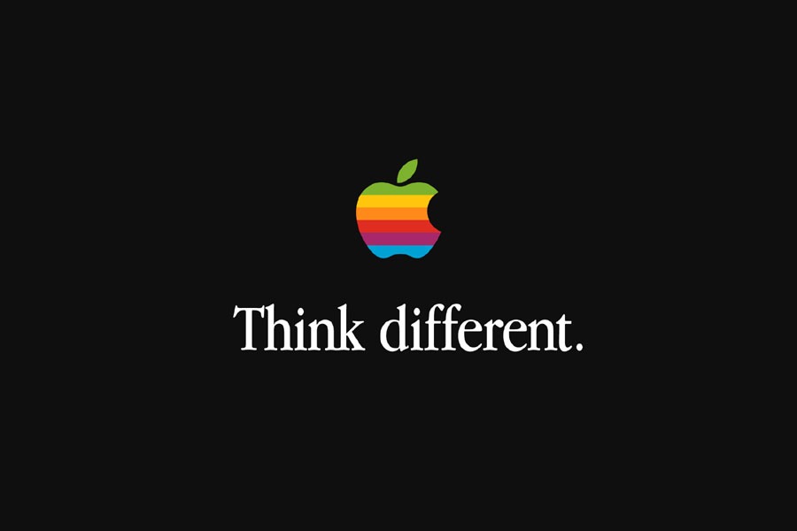 The rainbow Apple logo appears above the Think Different line on a black slate.