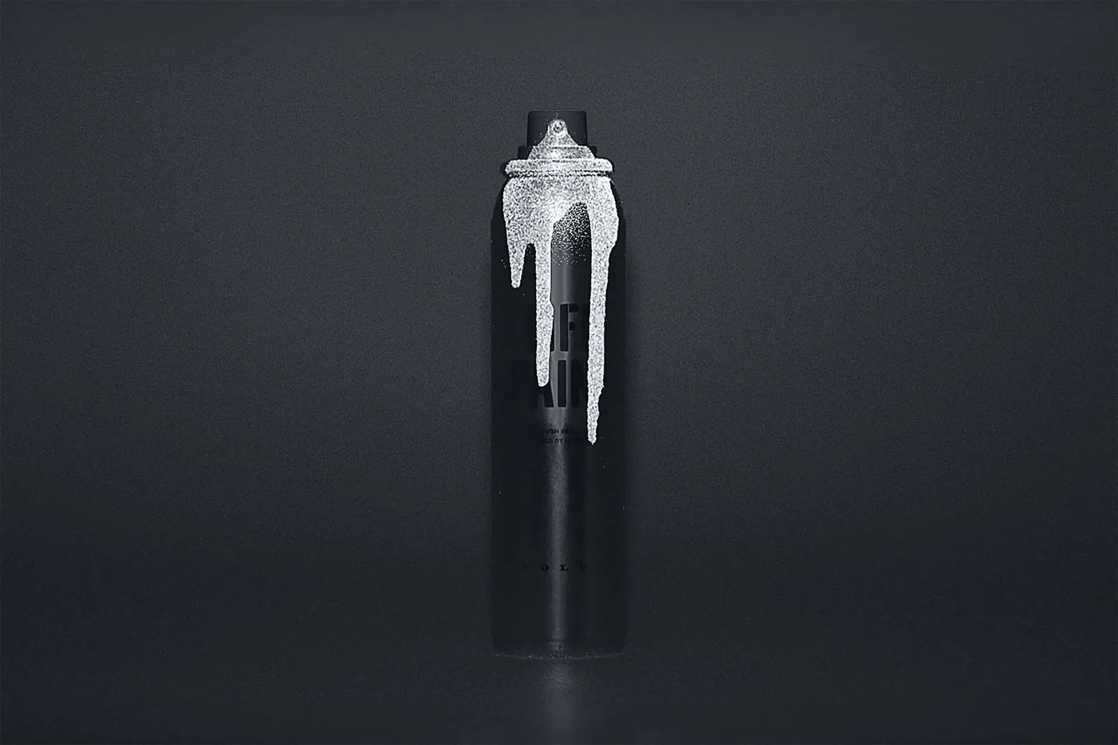 A LifePaint can partially illuminated by reflective spray against black