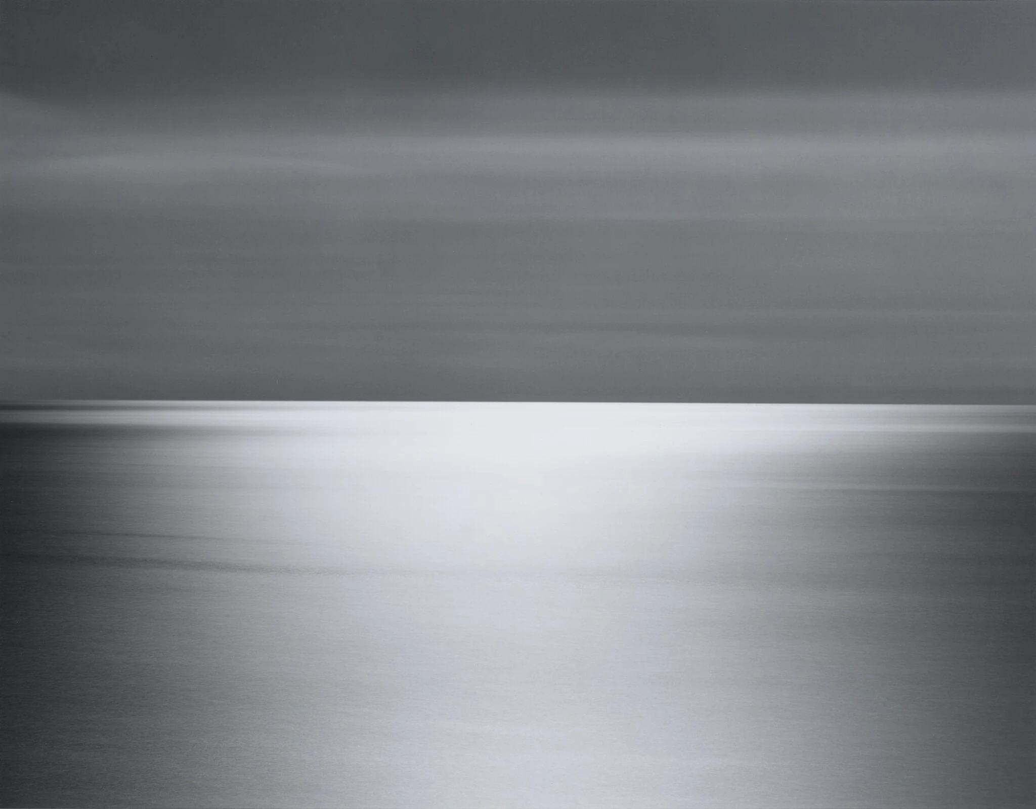Hiroshi Sugimoto's long-exposure black-and-white seascape divided by a distant horizon